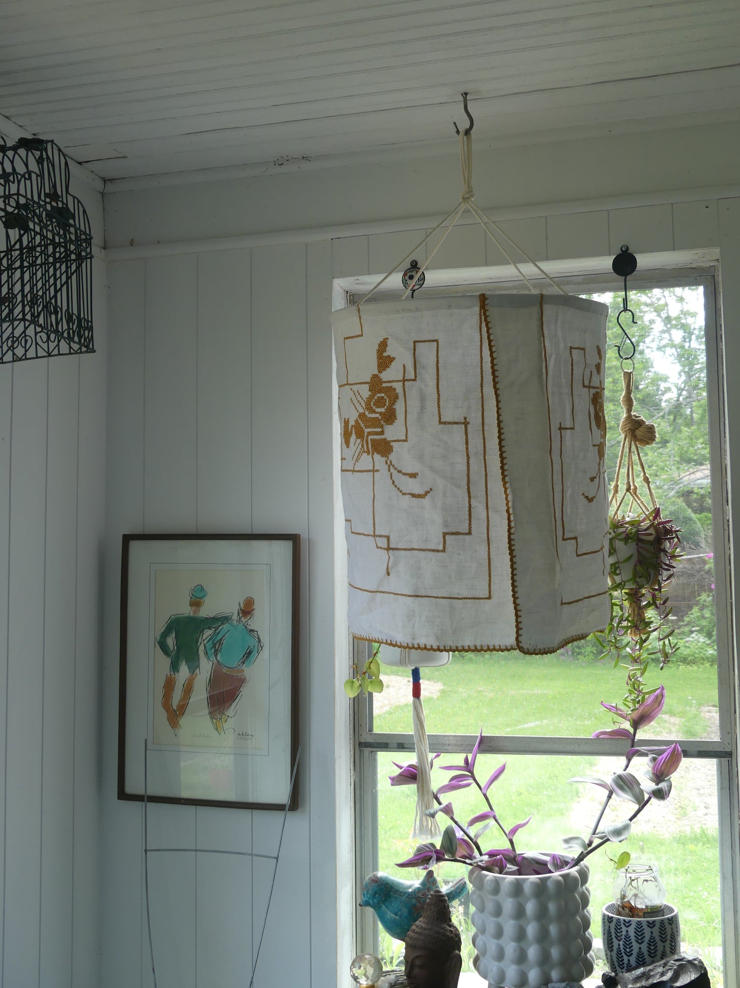White linen lantern with mustard embroidery detail