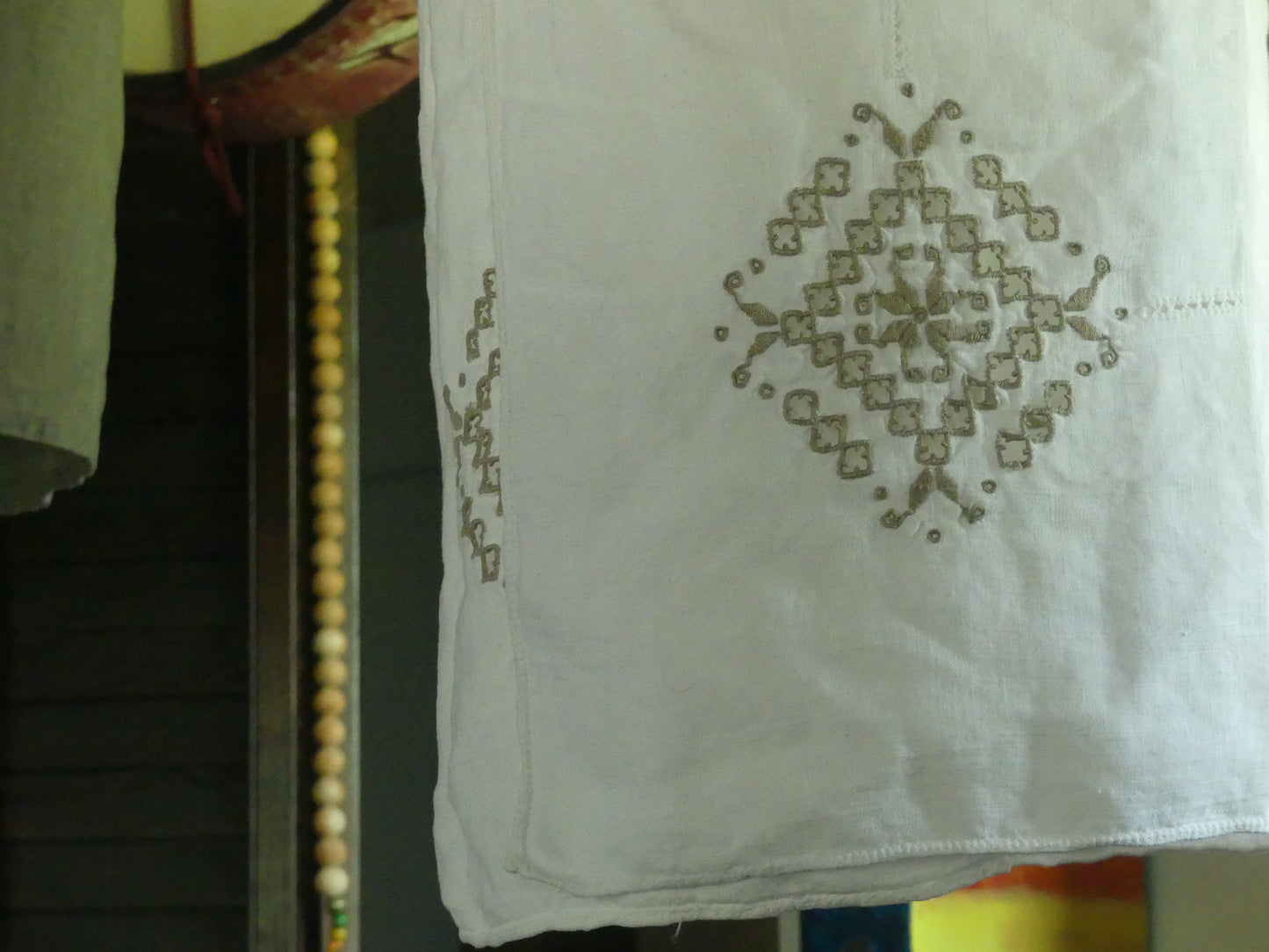 White linen lantern with tan embroidery detail