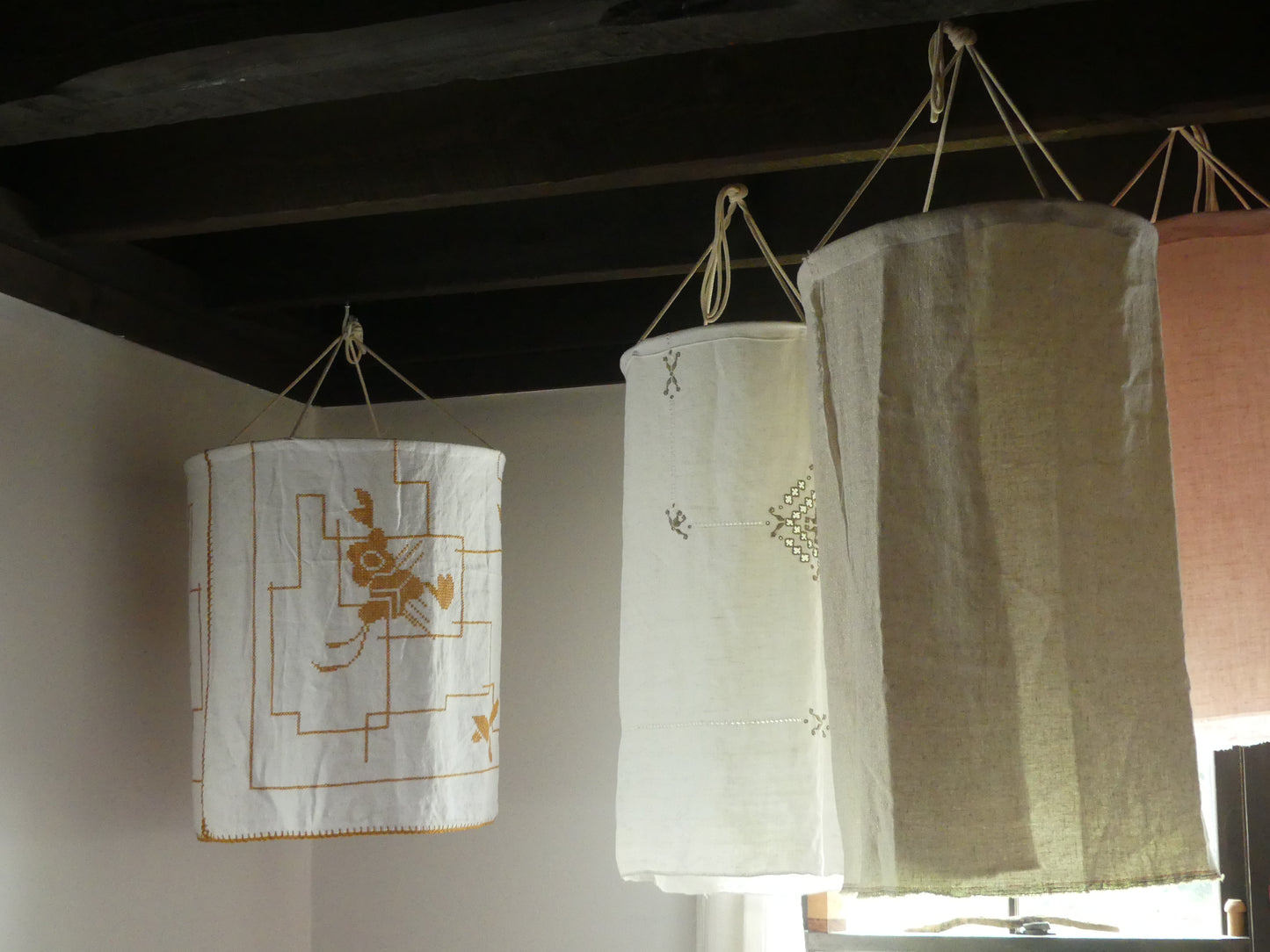 White linen lantern with mustard embroidery detail