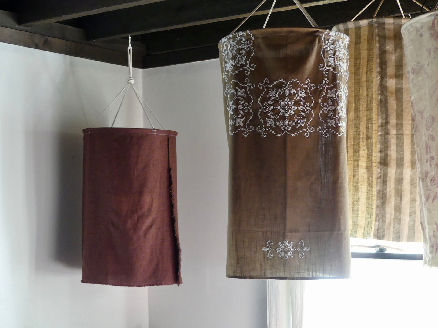 Brown linen lantern with white embroidery detail