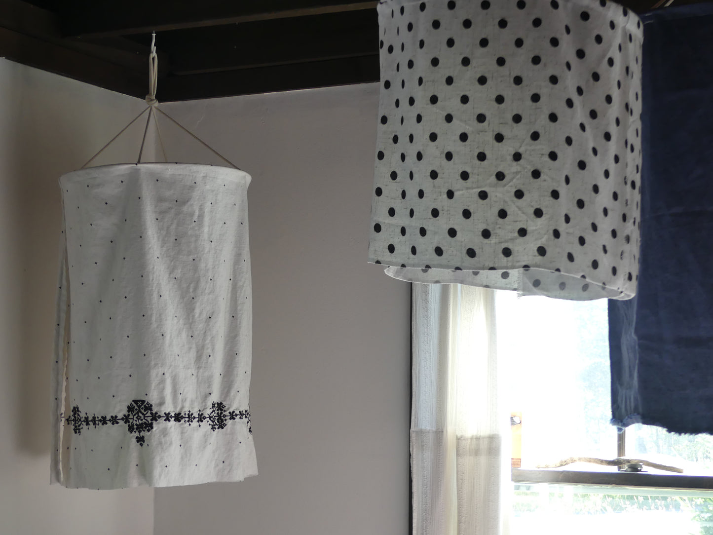 White linen lantern with black embroidery detail