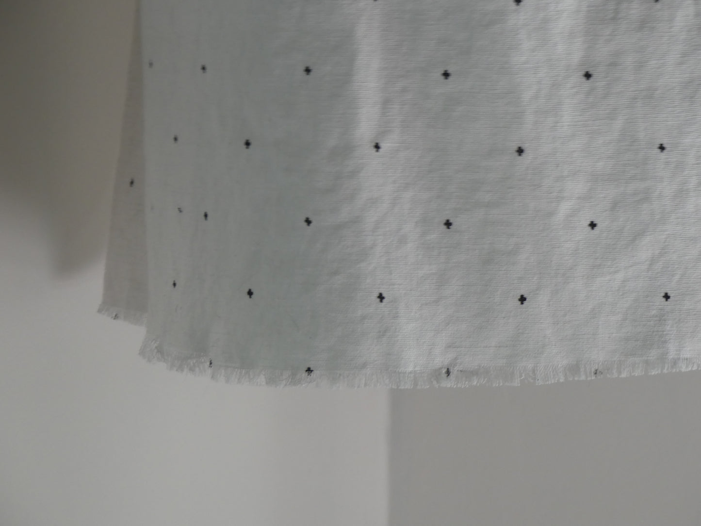 White linen lantern with black embroidery detail pattern