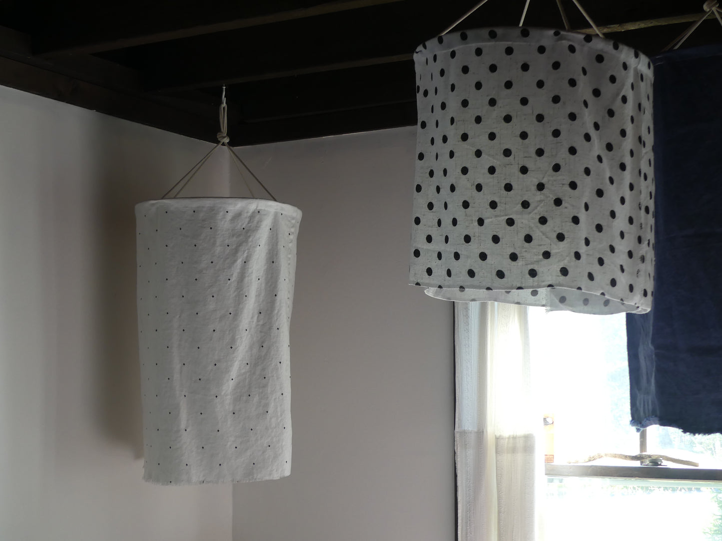White linen lantern with black embroidery detail pattern