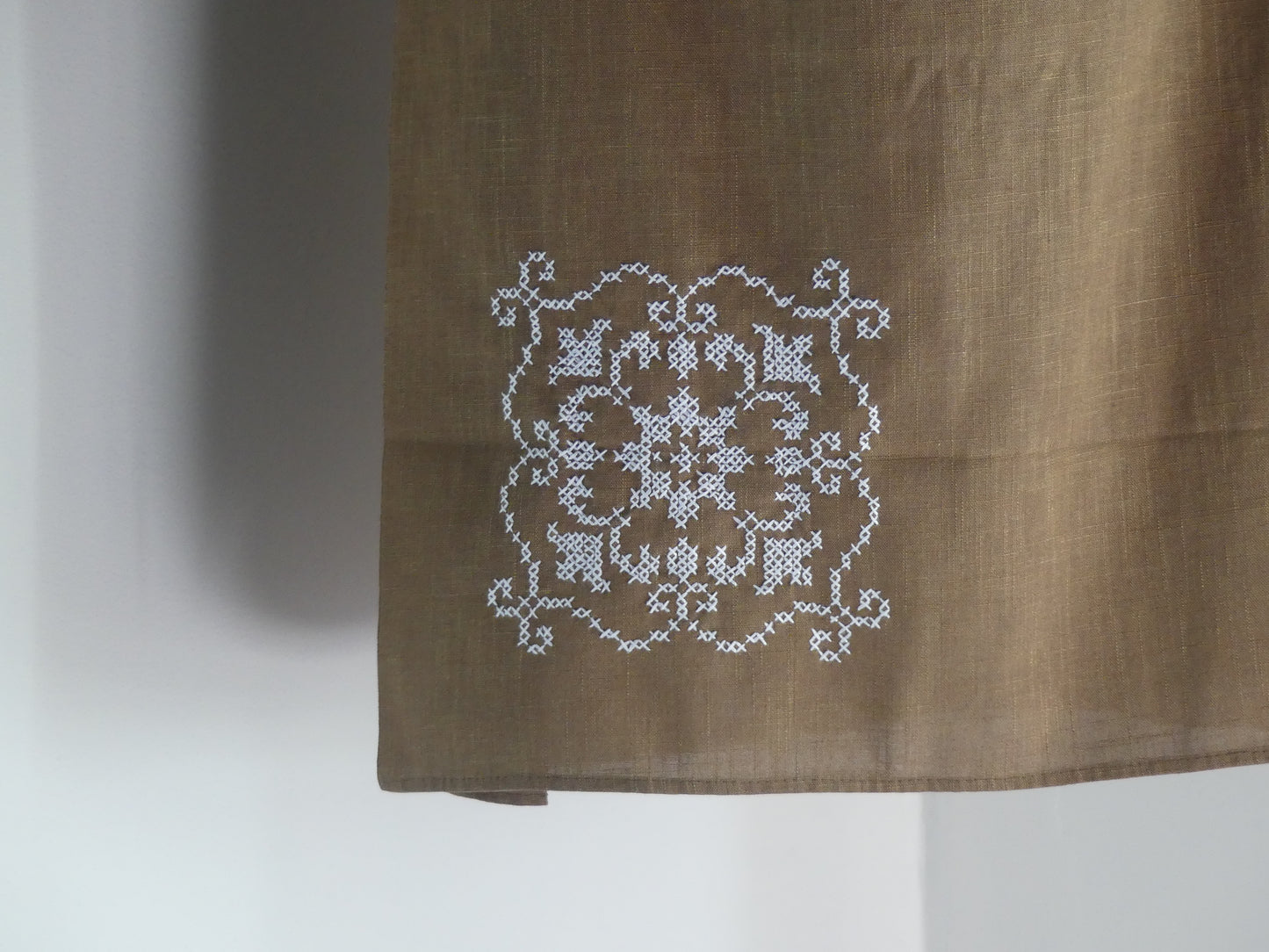 Brown linen lantern with white embroidery detail