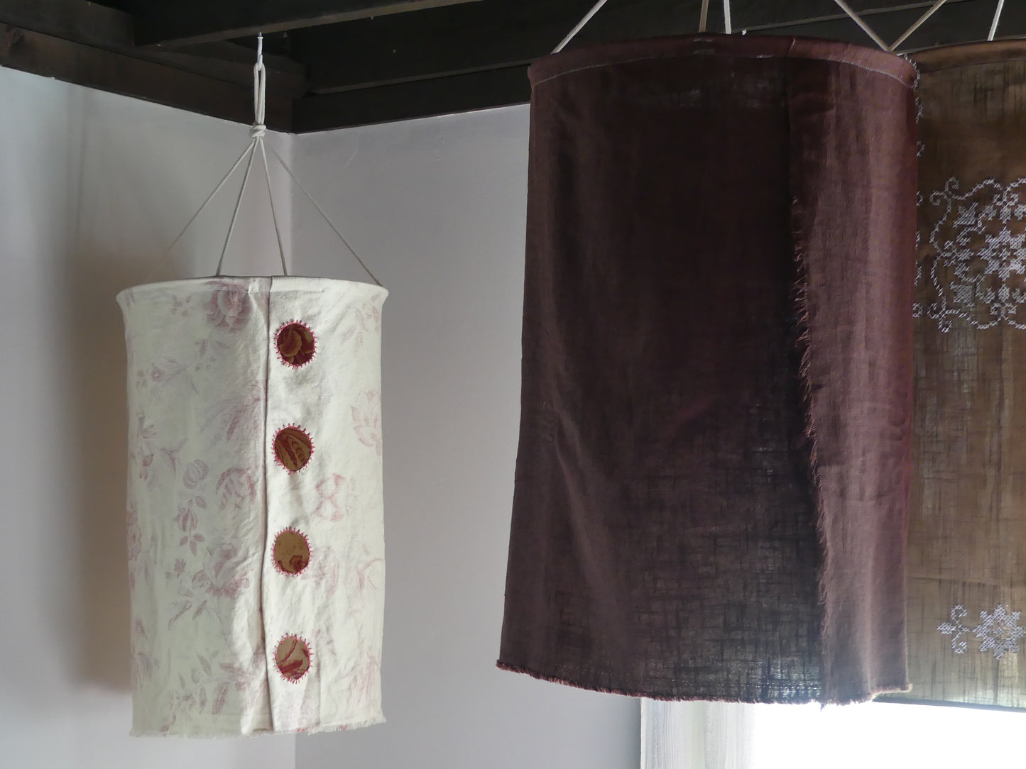 Patterned beige linen lantern with embroidered cutout windows