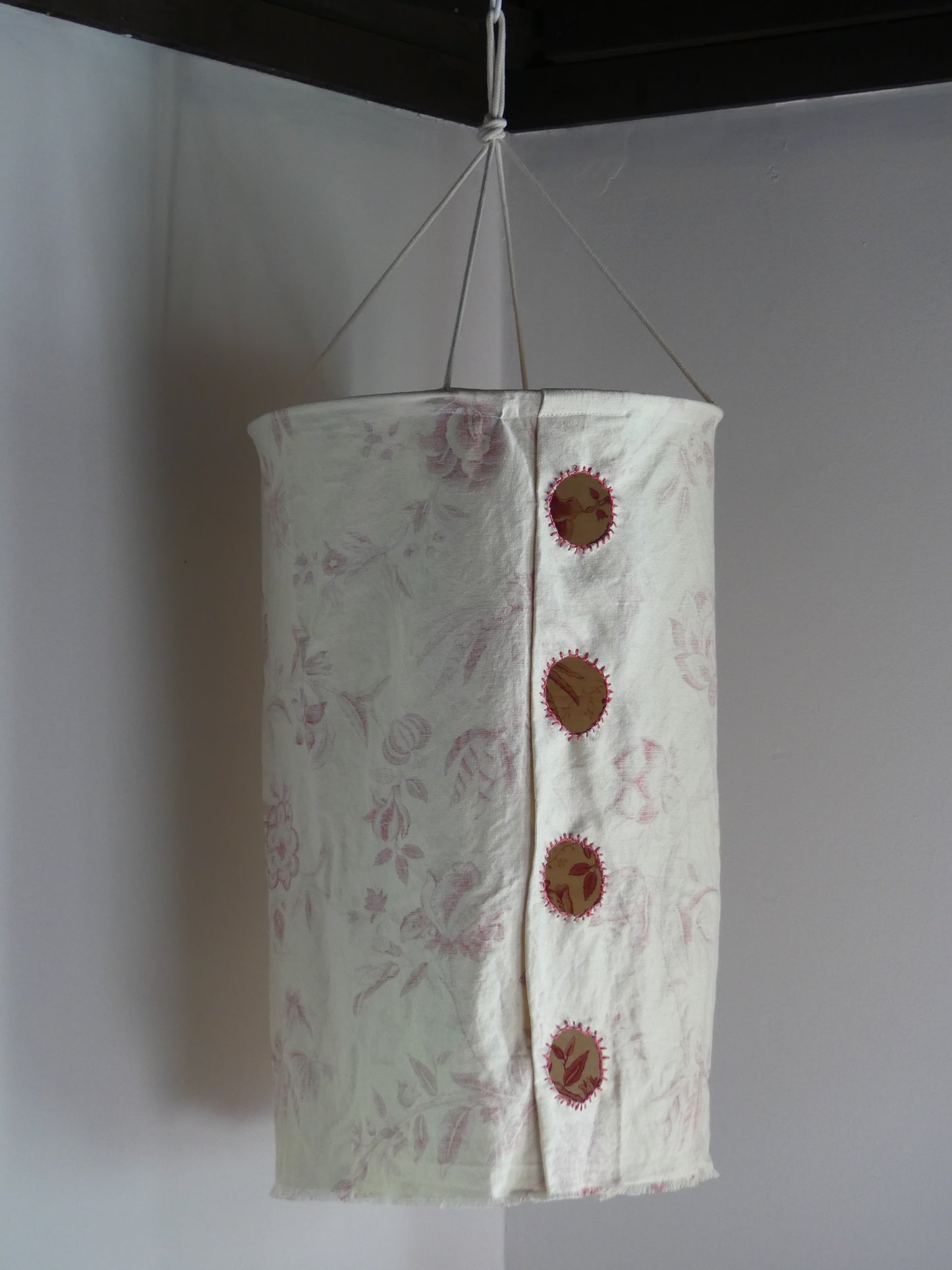 Patterned beige linen lantern with embroidered cutout windows