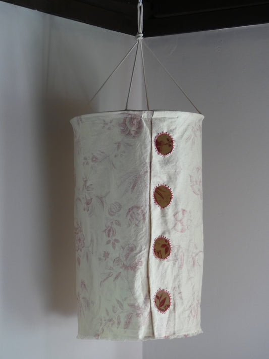 Patterned beige linen lantern with embroidered cutout windows
