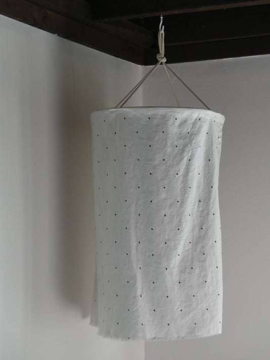 White linen lantern with black embroidery detail pattern